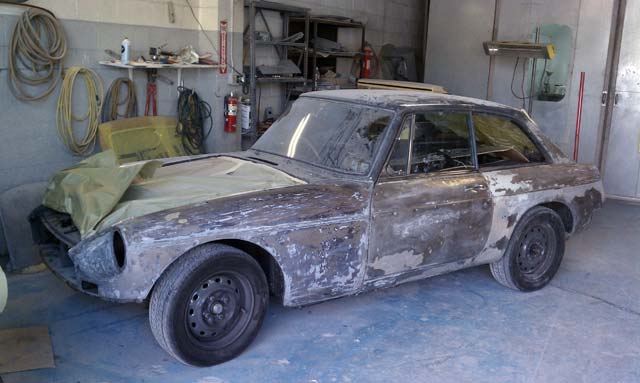 MGB GT being stripped of paint