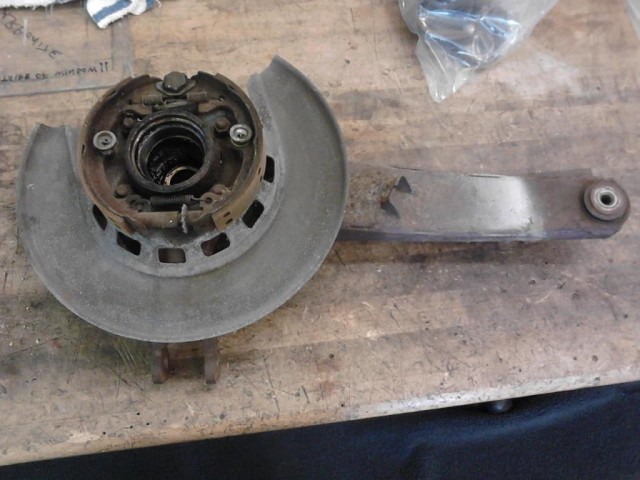 Trailing arm/spindle assembly (spindle removed) before disassembly