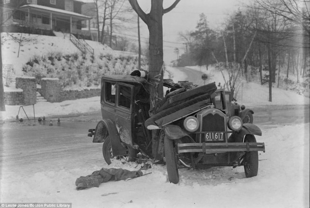 Taken in 1934, this photo shows a car that skidded out of control on ice-covered roads and wrapped around a tree in Auburndale, Mass.