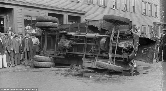 A truck collided with a bus and flipped over in south Boston, stopping just before it smashed into a cafeteria storefront