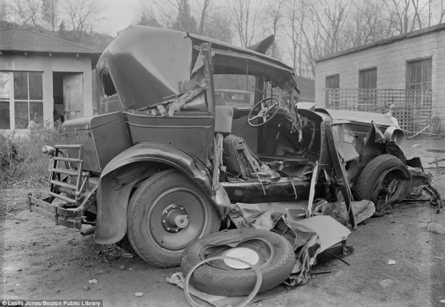 Sitting in a Boston wrecking yard, this cross section of a wreck shows how basic car interiors were in the early days of motoring.