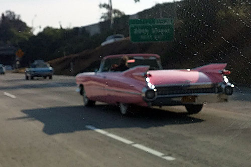 And a few miles later, his and hers - a pink Cadillac and a baby blue Mustang.  Sorry for the blurry photo.