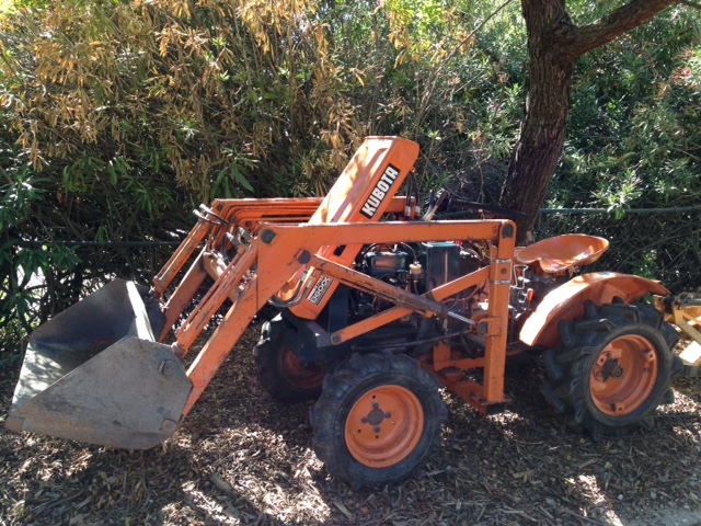 And the tractor back in its spot ready for work.