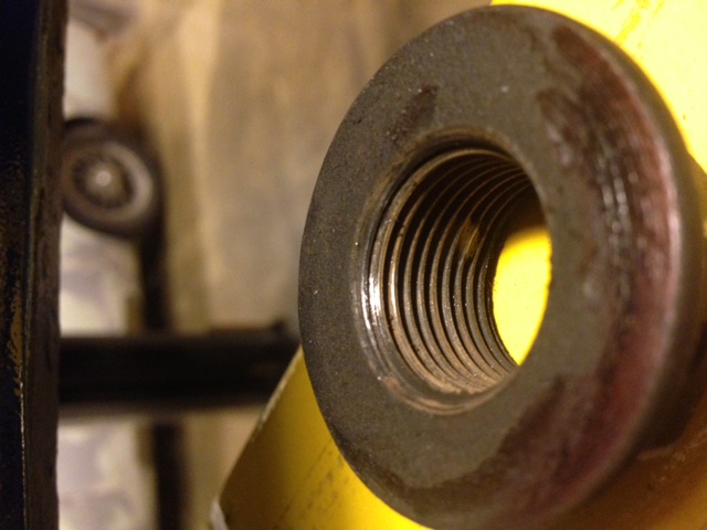 threads to the end of the flange nut