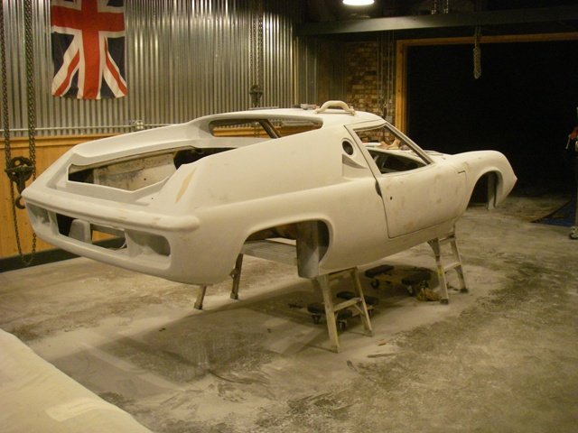 January 1; Guide coat off and the doors are hung; Hinges set and more additional issues now surface with the fitment; Hood and bonnet edges are aligned and filled.