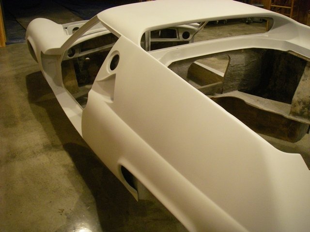 January 2; Doors back off and everything gets a third coat of primer.  It is starting to look a little more like a car body, but wow there is so much more to go.